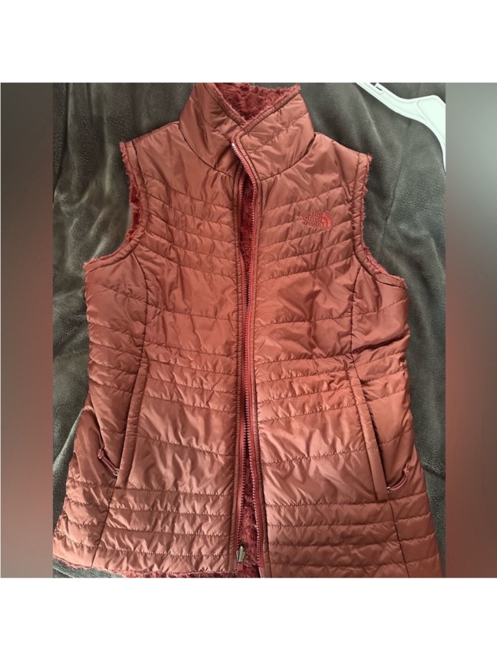 The North Face Reversible Women's Quilted Vest in Brown Rust Red Burgundy fuzzy